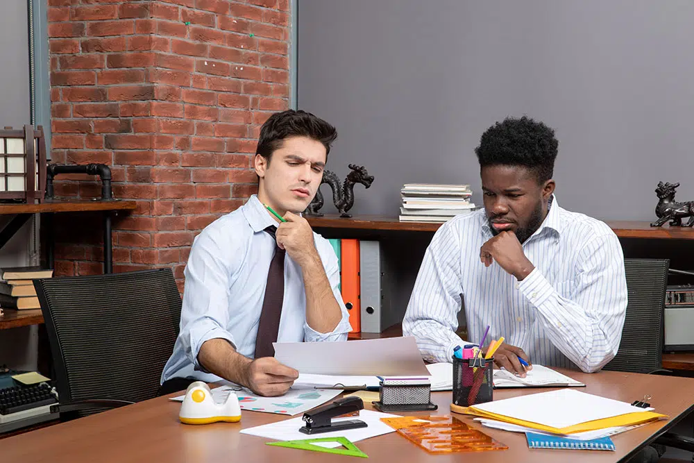 front-view-two-serious-businessmen-negotiating-business