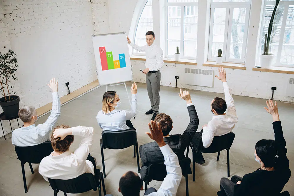 male-speaker-giving-presentation-hall-university-workshop-audience-conference-hall